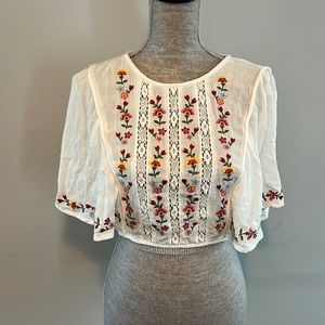 Forever 21 size small cropped blouse with embroidery and lace open back.
